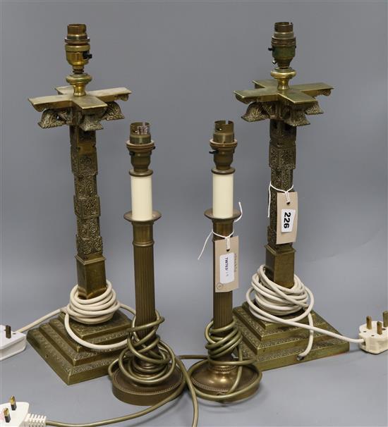 A pair of brass column table lamps and shades and another pair of table lamps and shades tallest 47cm